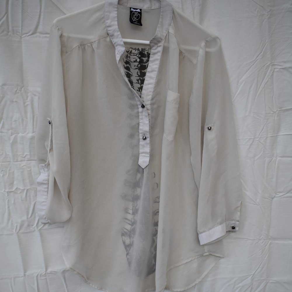 Sheer long sleeve spine graphic blouse